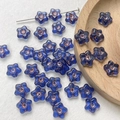 Detail of blue star-shaped Czech glass beads with bronze edges for DIY jewelry making - Blue Star Outlined Style(15#)-1 Piece