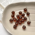 Macro detail of amber pumpkin glass beads with gold stripes for DIY jewelry making - 1 Piece / 7# Dark Amber