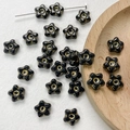 Detailed view of star-shaped Czech glass beads with gold centers for DIY jewelry making - Black Star Gold Center Style(17#)-1 Piece