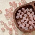 Macro shot of 8mm pink Czech glass beads with hand-painted roses for DIY jewelry making - Pink Translucent Carved (3#)