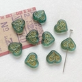 Detailed view of teal heart glass beads with golden floral patterns for DIY jewelry - 10# Teal