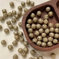 Macro view of 8mm champagne gold etched beads in a wooden heart tray for DIY jewelry - Champagne Gold Patterned (10#)