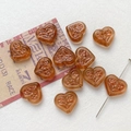 Detailed view of amber heart glass beads with vintage floral texture for DIY jewelry - 15# Dark Honey