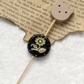 Detailed close-up of retro black Czech beads with golden sunflower patterns and wood button - Black Gold Sunflower With Wood Cat Head (Style 17)