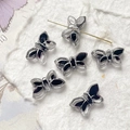 Detailed view of butterfly-shaped Czech glass beads with gold-leaf finish for DIY jewelry - Black Purple Silver Edged (5#) / 1 Piece