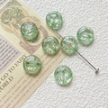 Macro detail of green translucent glass beads with angel relief for jewelry making - Light Green Angel Relief Style (3#) / 1 Piece Pack