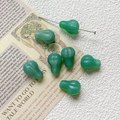 Macro view of translucent green glass beads with gold accents for DIY jewelry making - Emerald Green Textured Water Drop Style (9#) / 1 Piece Pack