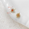 Makro-Detail von 18k vergoldeten Blumen-Ohrringen mit orangefarbenem Zirkon und 9x8mm Maß - 7# Paar (Gold Orange Stein Sonne)