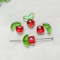 Macro shot of tulip-shaped glass beads with red petals and green leaves for DIY jewelry - Red 1 Set (Flower Bud + Leaf)