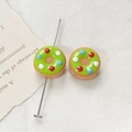 Close-up of donut-shaped glass beads in green and brown for DIY jewelry making - Green Coffee Dotted Donut (4#) (1 Piece)