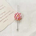 Detail showing orange donut glass bead on a 5cm metal pin for DIY jewelry making - Orange White Red Spiral Donut (8#) (1 Piece)