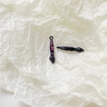 Close-up of creative brush alloy pendants with black finish and pink floral patterns - Black Brush