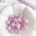 Detalle de cuentas ojo de gato violetas de 10mm en un bol blanco para joyería DIY - 10mm (10 Piezas/Paquete) / Púrpura