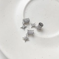 Macro view of three silver 18k gold-plated star charms with pavé set zirconia stones - White Gold