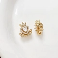 Close-up of heart carriage jewelry charm with 18k gold plating and zircon inlay - White