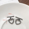 Close-up of heart-shaped toggle clasps in gun-black finish for jewelry making - Heart Shape (3#)