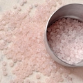 Macro detail of 4mm pink translucent glass seed beads for DIY jewelry making and crafts - 10 g / Pink
