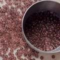 Macro shot of 4mm purple glass seed beads with center hole for DIY jewelry making - 10 g / Deep purple