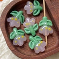 Macro detail of handmade light purple glass flower beads for DIY jewelry making - 1 Piece / Pink