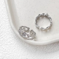 Detail of silver woven texture adjustable open rings on a white ceramic tray - 4# White Gold