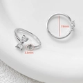 Macro detail of adjustable bow ring setting with zircon hearts and 3.8mm pearl base - Platinum Bowknot (D5093)