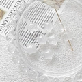 Close-up of star-shaped natural crystal quartz beads for DIY jewelry making and crafting - Clear Quartz