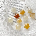 Macro view of star-shaped faceted natural stone beads for DIY jewelry making - Citrine