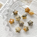 Detailed view of star-shaped natural crystal beads with unique mineral textures for DIY jewelry - Tan