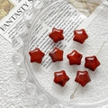 Detailed macro view of star shaped red jasper natural stone beads for DIY jewelry making - Dark Red