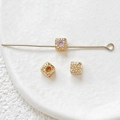 Macro shot of 18k gold-plated cube spacer beads with zircon inlays for DIY jewelry making - 18K Gold Plated Pink Zirconia