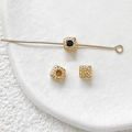 Detailed view of hammered 18k gold-plated square beads with blue zircon for DIY jewelry - 18K Gold Black Zirconia