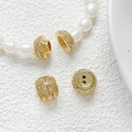 Macro shot of gold-plated screw clasp with micro-set zircon for DIY pearl necklaces - 18k Gold Round Screw Clasp