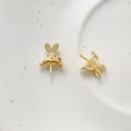 Detailed view of gold rabbit ear charms with red crystals and white cubic zirconia accents - Hat Rabbit / 18K Gold