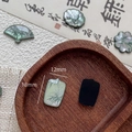 Macro shot of 18x12mm green resin bamboo charms for DIY jewelry making accessories - Rectangle Style