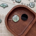 Macro shot of 18mm shell resin four-petal flower charm with green bamboo patterns - Four-leaf Flower Style