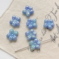 Close-up of iridescent light blue flower beads with horizontal holes for DIY jewelry - Iridescent Blue (4#1 Piece)