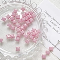 Close-up of pink star-shaped glass beads for DIY jewelry making and handmade crafts - Soft Pink