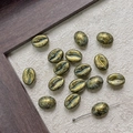 Macro detail of coffee bean shaped beads with vintage metallic finish for DIY jewelry - Vintage Gold Green (1#)