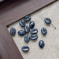 Macro shot of dark blue coffee bean shaped glass beads with metallic sand texture and DIY hole - Deep Blue Quicksand (7#)