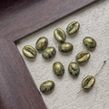 Detail of coffee bean shaped glass beads with vintage blue and gold leaf texture for DIY craft - Cyan Gold Foil (9#)