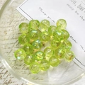 Macro shot of grass green Czech glass beads with irregular faceted cut and AB coating - Aurora Faceted Grass Green Style (2#)