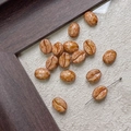 Macro view of coffee bean shaped Czech glass beads for DIY jewelry making and crafts - Glazed Brown Coffee (14#)