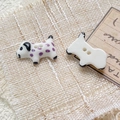 Macro shot of hand-painted ceramic dalmatian puppy two-hole beads for jewelry DIY - Style 5