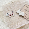 Macro shot of two-hole hand-painted ceramic dalmatian dog buttons for DIY jewelry - Style 6