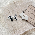 Detail of hand-painted ceramic dalmatian puppy beads with two holes for DIY jewelry - Style 10