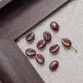 Macro shot of bronze coffee bean beads with vintage patina and metal threading needle - Bronze Cyan Mottled (21#)