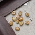 Detail of coffee bean shaped glass beads with realistic spotted texture for DIY jewelry - Beige Brown Spotted (24#)