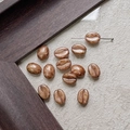 Detailed macro view of coffee bean shaped glass beads with polished glaze and center holes - Glazed Deep Brown (26#)
