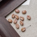 Macro detail of coffee bean shaped glass beads in dusty pink for DIY jewelry making - Warm Pink Purple (27#)