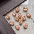 Macro detail of coffee bean shaped glass beads with pink glaze for DIY jewelry making - Pink Base Brown Pattern (28#)